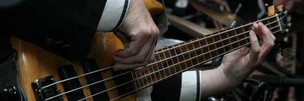 Musical performer playing bass live music miami