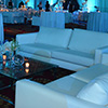Professional event designers transform space into sprawling luxurious venue with atmospheric lighting